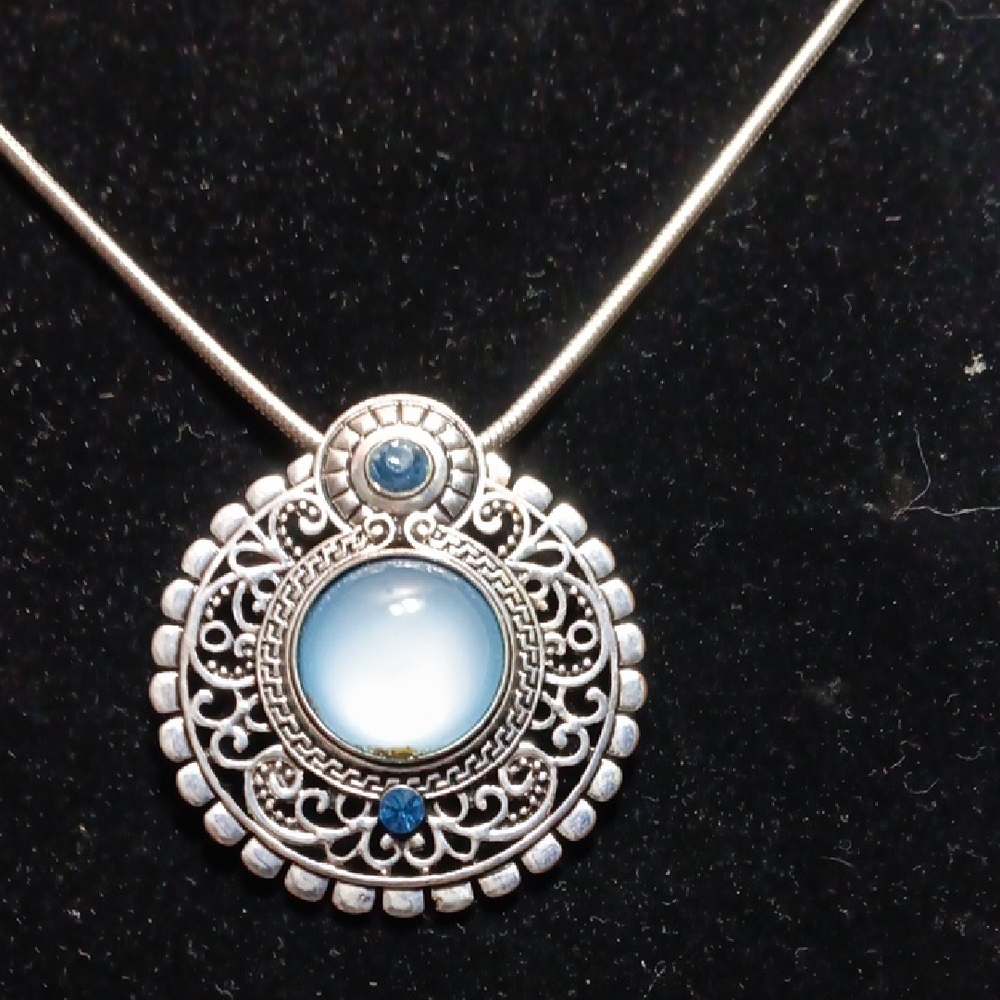 Intricate Silver and rainbow moonstone With blue gemstones,